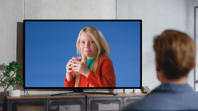Girl featured in advert displayed on a TV screen